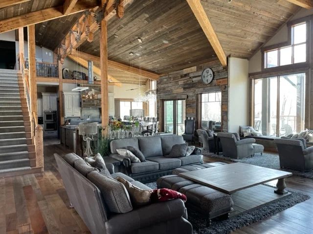 Client interior with generous windows and warm timber details